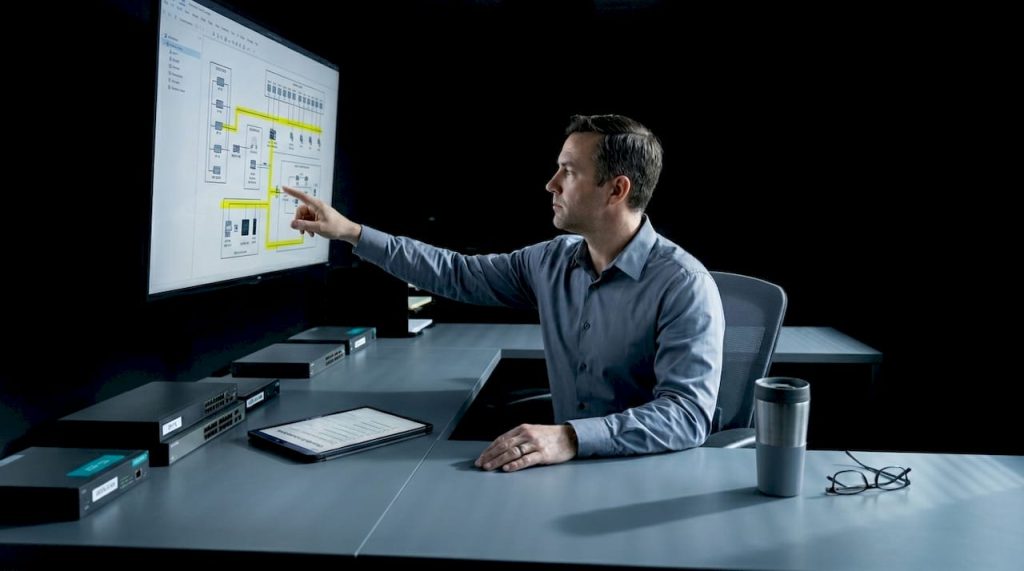 Facility manager reviewing network infrastructure map