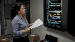 Property manager inspecting structured network cabling