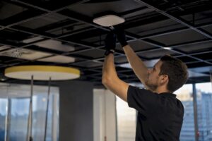 Technician connecting cable to AP